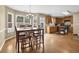 Eat-in kitchen area with table and chairs, lots of windows for natural light, and hardwood floors at 1267 Castleberry Dr, Buford, GA 30518