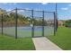 Fenced tennis court for recreational enjoyment in a well-maintained community setting at 1267 Castleberry Dr, Buford, GA 30518