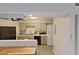 Functional kitchen featuring modern appliances, updated cabinets, and laundry facilities at 4701 Flat Shoals Rd # 50A, Union City, GA 30291