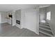 Stylish living area showcasing contemporary flooring, fireplace, staircase, and open layout to kitchen at 4701 Flat Shoals Rd # 50A, Union City, GA 30291