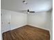 Bedroom with hardwood flooring, modern fan, and natural light at 6751 Davidson Ct, Lithonia, GA 30058