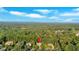 Aerial view showcasing the home's location nestled among a canopy of lush, mature trees at 1220 Waterfall Nw Ln, Acworth, GA 30101
