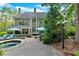 Stunning backyard with a pool, patio area, and lush landscaping, perfect for entertaining at 1220 Waterfall Nw Ln, Acworth, GA 30101