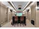 Home theater featuring a large viewing screen, sconce lighting, and leather seats at 1220 Waterfall Nw Ln, Acworth, GA 30101