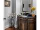 Charming powder room featuring a decorative vanity and elegant accents at 1220 Waterfall Nw Ln, Acworth, GA 30101