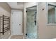 Bathroom with a glass-enclosed shower, modern fixtures, and towel rack at 1220 Waterfall Nw Ln, Acworth, GA 30101