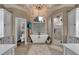 Elegant bathroom with a freestanding tub, a glass-enclosed shower, and stylish fixtures under a vaulted ceiling at 1220 Waterfall Nw Ln, Acworth, GA 30101