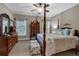 Bedroom featuring a four poster bed, accent pillows and a ceiling fan at 1220 Waterfall Nw Ln, Acworth, GA 30101