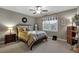 Cozy bedroom featuring neutral walls, a ceiling fan, and natural lighting from the window at 1220 Waterfall Nw Ln, Acworth, GA 30101
