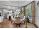 Bright dining area with natural light featuring a circular table, chairs and view into the kitchen at 1220 Waterfall Nw Ln, Acworth, GA 30101