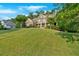 Two-story home with stone accents, manicured lawn, and mature landscaping at 1220 Waterfall Nw Ln, Acworth, GA 30101