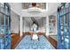 Elegant foyer with hardwood floors, grand staircase, and stylish decor at 1220 Waterfall Nw Ln, Acworth, GA 30101