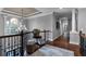 Open and airy hallway on upper level featuring hardwood floors and natural light at 1220 Waterfall Nw Ln, Acworth, GA 30101