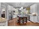 Charming kitchen with white cabinetry, granite countertops, stainless steel appliances, and a center island at 1220 Waterfall Nw Ln, Acworth, GA 30101