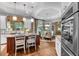 Bright kitchen featuring a center island, modern lighting, granite countertops and breakfast area at 1220 Waterfall Nw Ln, Acworth, GA 30101