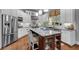 Inviting kitchen with granite counters, stainless steel appliances, and a convenient center island at 1220 Waterfall Nw Ln, Acworth, GA 30101