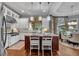 Spacious kitchen with white cabinets, granite countertops, stainless steel appliances, and center island at 1220 Waterfall Nw Ln, Acworth, GA 30101