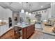 Bright and modern kitchen featuring white cabinetry, granite countertops, stainless steel appliances, and a center island at 1220 Waterfall Nw Ln, Acworth, GA 30101