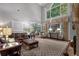 Bright living room with cathedral ceilings, large windows, and beautiful hardwood floors at 1220 Waterfall Nw Ln, Acworth, GA 30101