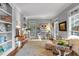Bright living room with built-in bookshelves and ample natural light at 1220 Waterfall Nw Ln, Acworth, GA 30101