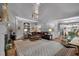 Open-concept living room with lots of seating, fireplace and open floor plan with a view into the kitchen at 1220 Waterfall Nw Ln, Acworth, GA 30101