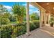 Covered porch with classic white columns and a scenic view of the front yard at 1220 Waterfall Nw Ln, Acworth, GA 30101