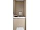 Small toilet room featuring a toilet and a built-in shelf with sliding door at 1220 Waterfall Nw Ln, Acworth, GA 30101