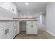 Finished basement area with a bar setup, white cabinets, and an open layout, perfect for entertaining at 1706 Brandon Lee Sw Way, Marietta, GA 30008