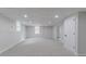 Finished basement with carpeting, recessed lighting, access to rooms, and egress window at 1706 Brandon Lee Sw Way, Marietta, GA 30008