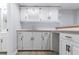 Basement bar area with white cabinets, butcher block countertops, and a nearby bathroom with a shower at 1706 Brandon Lee Sw Way, Marietta, GA 30008