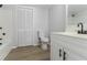 Well-lit bathroom featuring white cabinets, modern fixtures, and a shower and tub combination at 1706 Brandon Lee Sw Way, Marietta, GA 30008