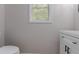 Powder room features a window and a modern vanity at 1706 Brandon Lee Sw Way, Marietta, GA 30008
