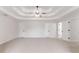 Large bedroom features a tray ceiling and multiple closets and doors at 1706 Brandon Lee Sw Way, Marietta, GA 30008