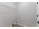 Walk-in closet with a hanging rack system and updated flooring at 1706 Brandon Lee Sw Way, Marietta, GA 30008