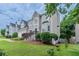 Side view of a gray two-story house showcasing its landscaping and architectural details at 1706 Brandon Lee Sw Way, Marietta, GA 30008