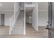 Bright foyer features a staircase, fresh paint and flooring, and an open layout at 1706 Brandon Lee Sw Way, Marietta, GA 30008