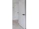 Hallway with carpet, neutral walls, and white doors at 1706 Brandon Lee Sw Way, Marietta, GA 30008