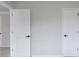 Hallway featuring neutral carpet and white doors at 1706 Brandon Lee Sw Way, Marietta, GA 30008