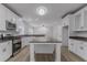 Modern kitchen with stainless steel appliances, white cabinets, granite countertops, and a spacious island at 1706 Brandon Lee Sw Way, Marietta, GA 30008