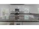 A kitchen island with granite countertops and stainless steel appliances offers a modern touch at 1706 Brandon Lee Sw Way, Marietta, GA 30008