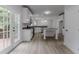 Bright and spacious kitchen with white cabinetry, stainless steel appliances, and access to the outdoors at 1706 Brandon Lee Sw Way, Marietta, GA 30008