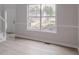 Bright living room featuring a large window with neighborhood views at 1706 Brandon Lee Sw Way, Marietta, GA 30008