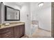 Bathroom featuring vanity, commode, and large soaking tub at 2010 Pearwood Path, Roswell, GA 30076