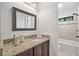 Bathroom featuring granite countertop and neutral tile at 2010 Pearwood Path, Roswell, GA 30076