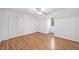 Bedroom with hardwood floors, double closet, and ceiling fan at 2010 Pearwood Path, Roswell, GA 30076