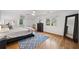 Well-lit main bedroom featuring ceiling fan, hardwood floors, and lots of space at 2010 Pearwood Path, Roswell, GA 30076