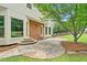 Outdoor patio featuring stone steps, a stone surface, and access to the backyard lawn at 2010 Pearwood Path, Roswell, GA 30076