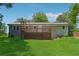Back exterior of home with fenced yard and wood deck at 2060 Panstone Sw Ct, Marietta, GA 30060