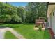Large backyard with green grass and wood deck at 2060 Panstone Sw Ct, Marietta, GA 30060