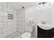 Bathroom features white marble tile, a sleek vanity, and a stand-up shower at 2060 Panstone Sw Ct, Marietta, GA 30060